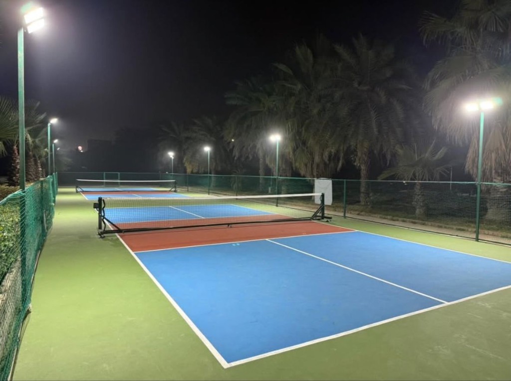 Night-lit outdoor pickleball courts at The Social Court Jalandhar